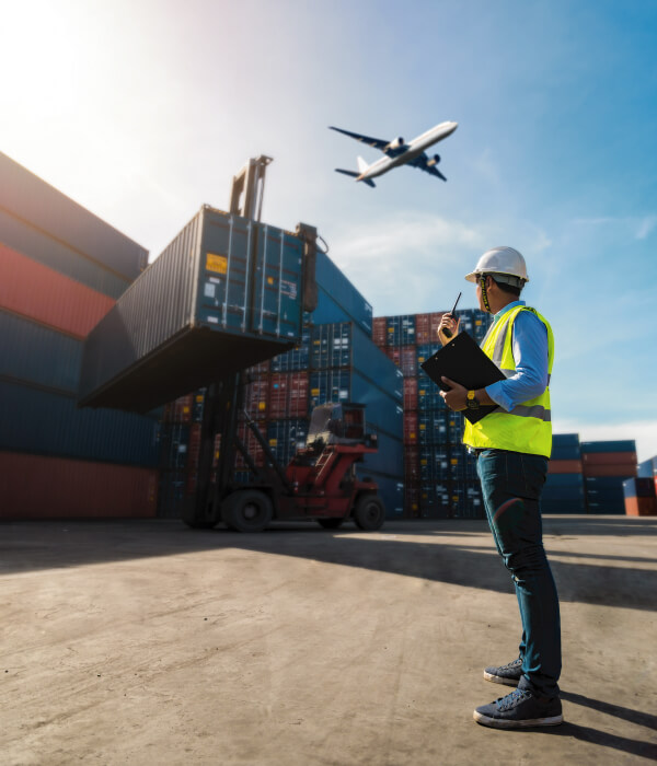 Foreman control loading Containers box to truck for Logistic, airplane overhead