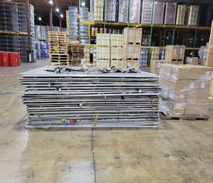 Palletized Items on floor, Stacked pallets on warehouse shelves in background